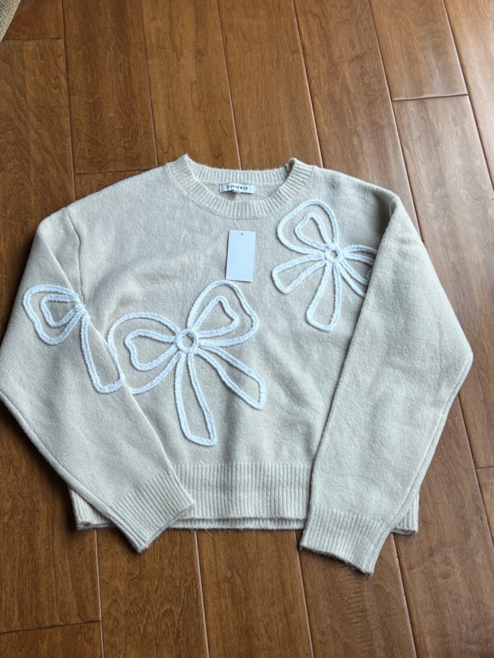 Hooked Up by IOT Cream Crewneck Sweater with Bow Appliqués